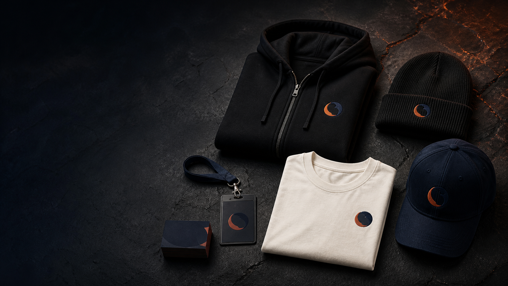 Branded shirts, hoodies, hats and employee identification arranged for a business merchandise project